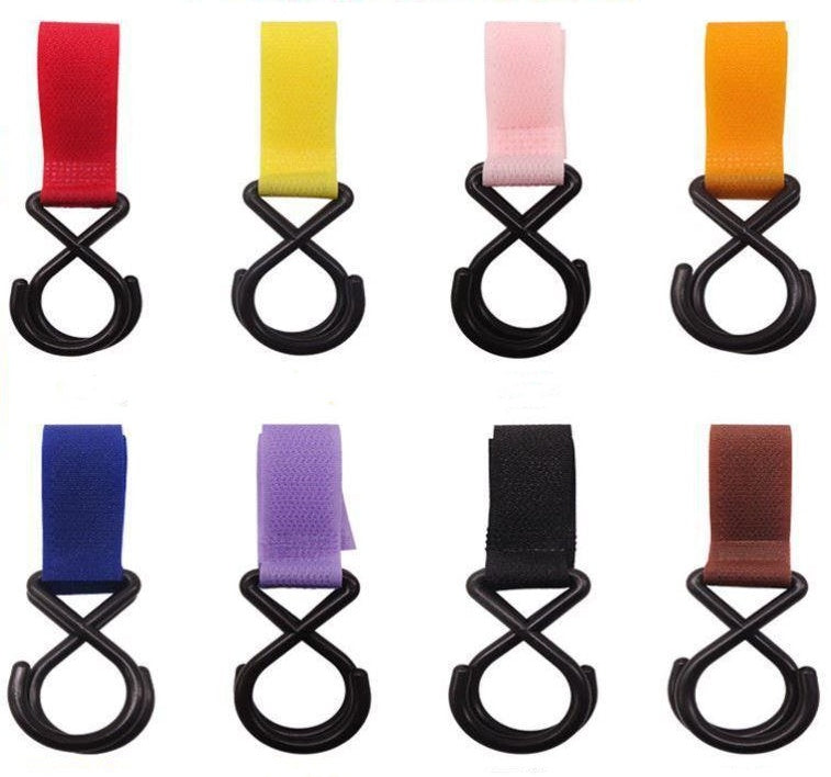 Set of colorful straps with black hooks on a white background