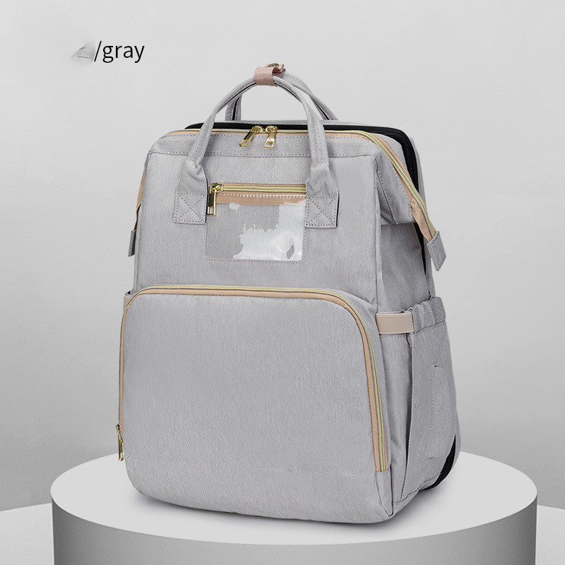 Gray backpack with gold accents on a white background