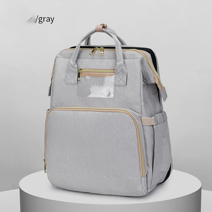Gray backpack with gold accents on a white background