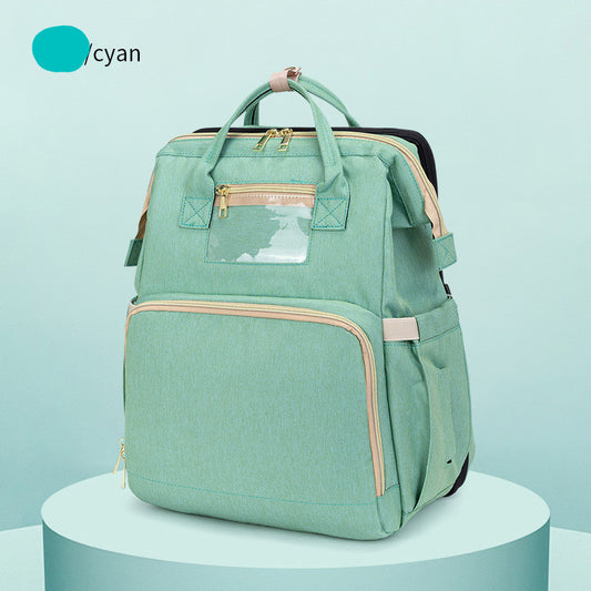 Green backpack on a light blue background with 'cyan' brand logo.