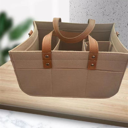 Felt diaper organizer bag showing compartments for bottles and baby essentials