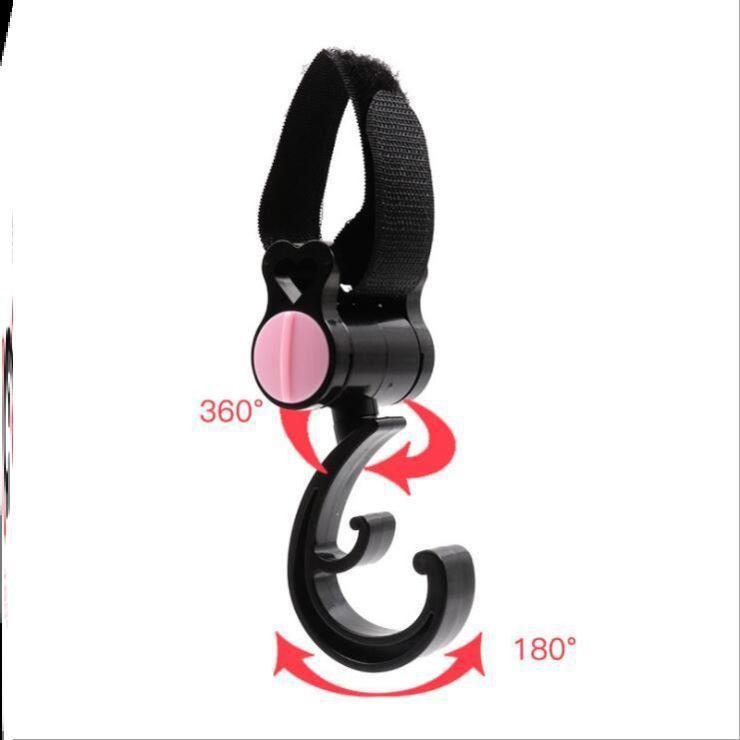 Black car hook with pink center on a white background