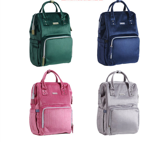 Four backpacks in green, blue, pink, and gray on a white background