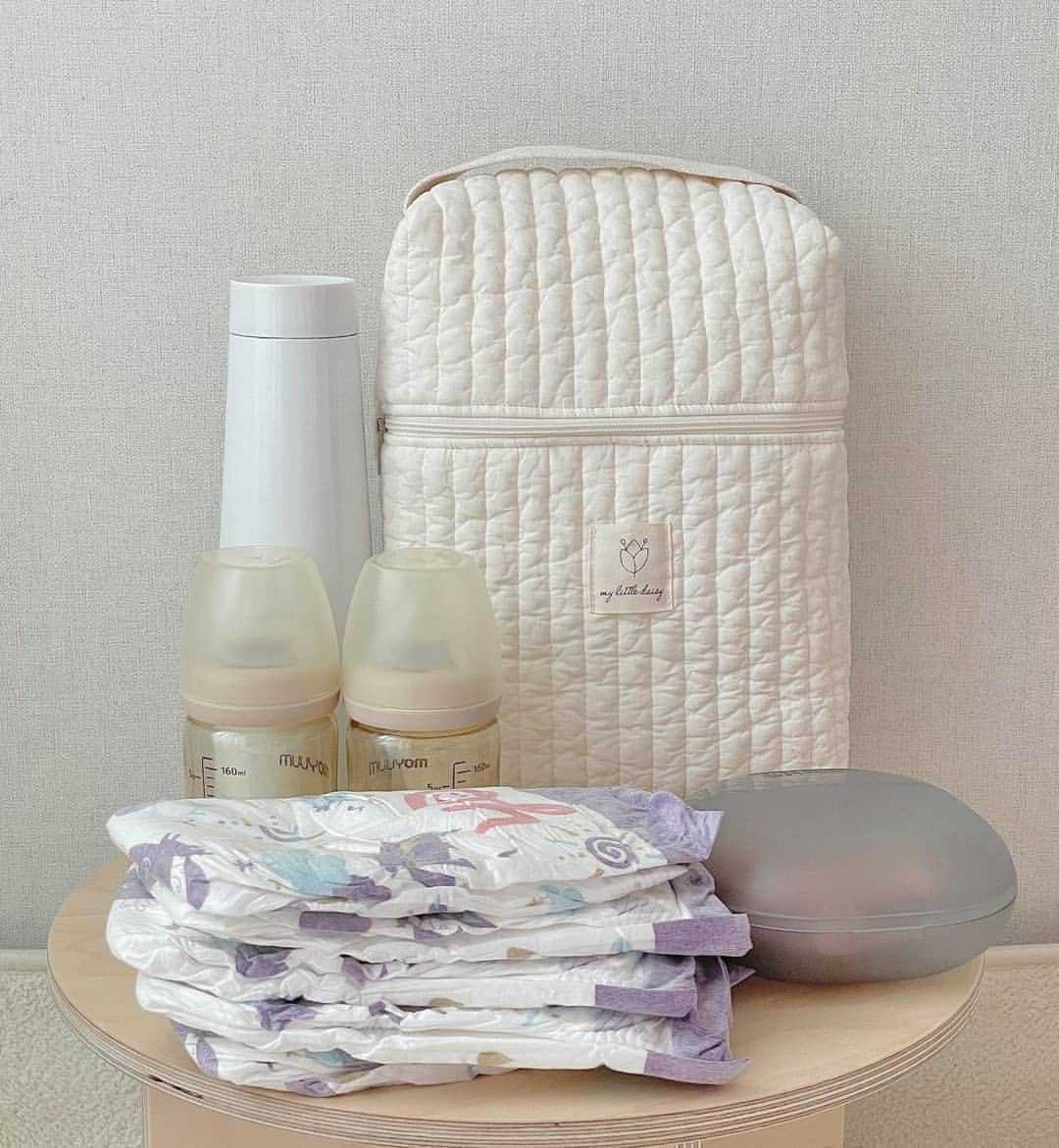 Portable diaper storage bag with handles for easy carrying and travel