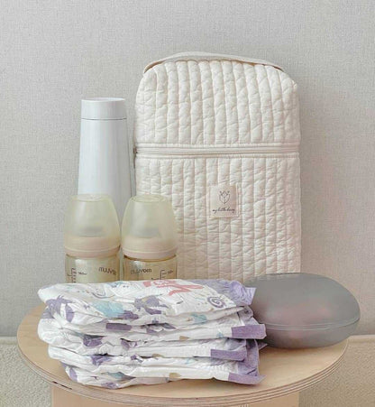 Portable diaper storage bag with handles for easy carrying and travel