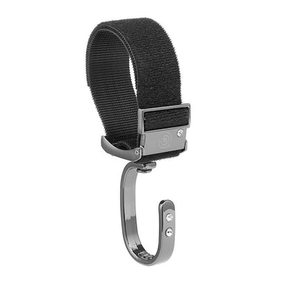 Stroller bag hook demonstrating secure grip on handlebar with multiple bags