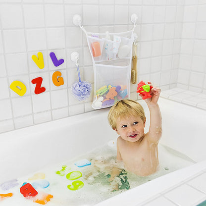 Child in a bathtub with bath toys and a hanging organizer on a tiled wall.