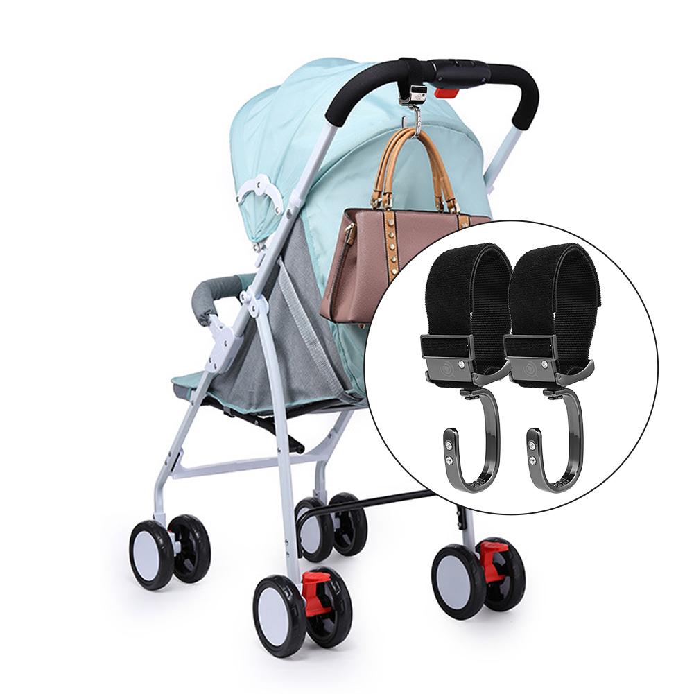 Universal stroller hook attached to baby stroller handlebar with shopping bag