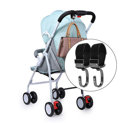 Universal stroller hook attached to baby stroller handlebar with shopping bag