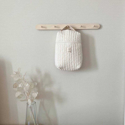 Diaper storage bag showing versatile use for nursery organization and outings