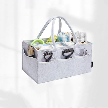 Mummy diaper bag showing durable felt construction and practical design